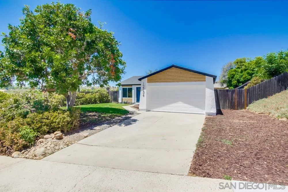 12736 Roberto Way Poway, CA 92064 - Photo 34 of 34 a front view of a house with a yard and garage