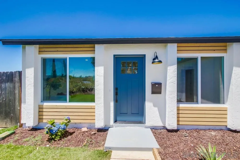 12736 Roberto Way Poway, CA 92064 - Photo 4 of 34 a front view of a house with a garage
