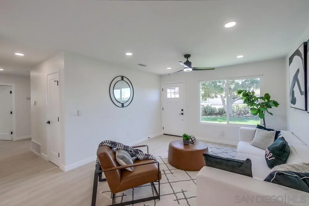 12736 Roberto Way Poway, CA 92064 - Photo 5 of 34 a living room with furniture and a large window