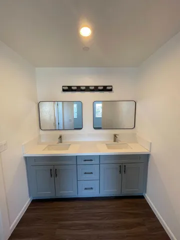a kitchen with stainless steel appliances granite countertop a sink and a stove