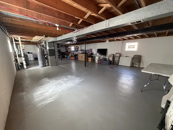 a view of a studio with wooden floor