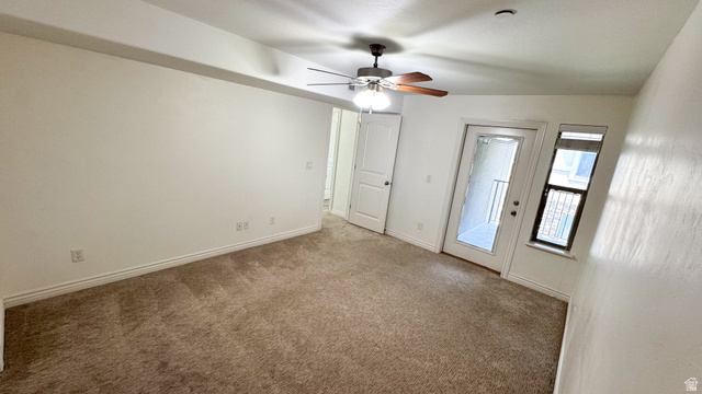 909 South Main Street, Unit F Layton, UT 84041 - Photo 11 of 21 Neutral tone wall finishes complemented by a brown carpet