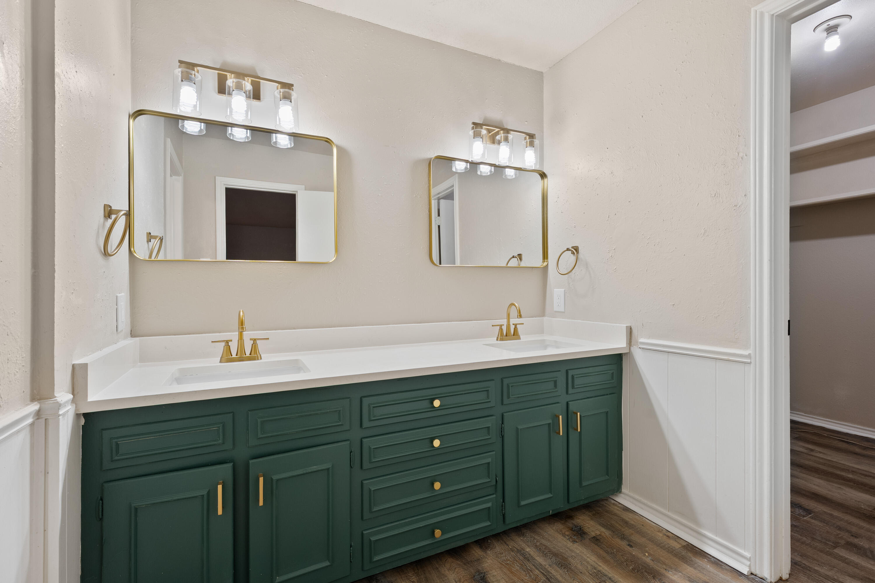 7902 Lynnhaven Avenue Lubbock, TX 79423 - Photo 19 of 35 a bathroom with a double vanity sink and mirror