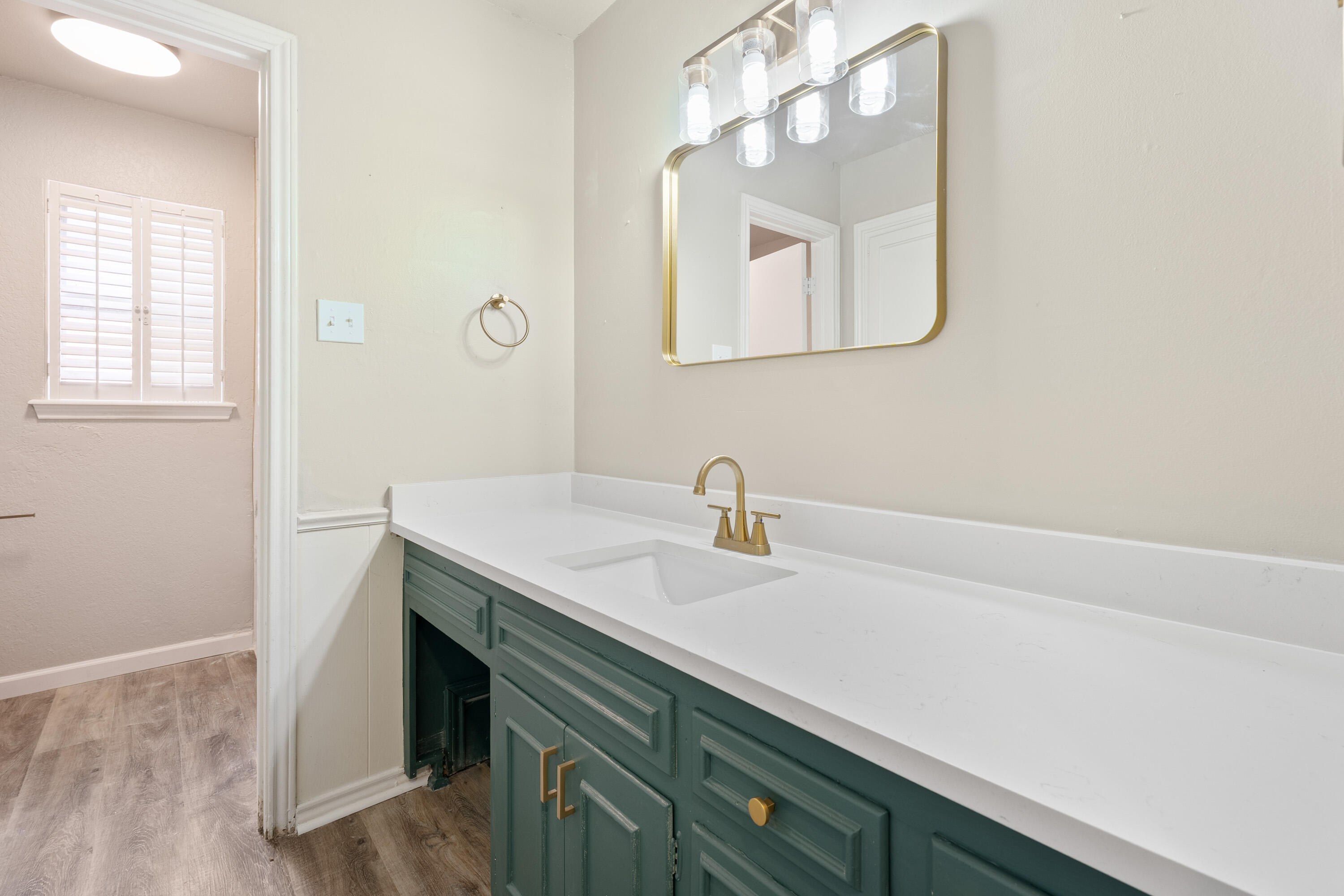 7902 Lynnhaven Avenue Lubbock, TX 79423 - Photo 20 of 35 a bathroom with a sink and a mirror