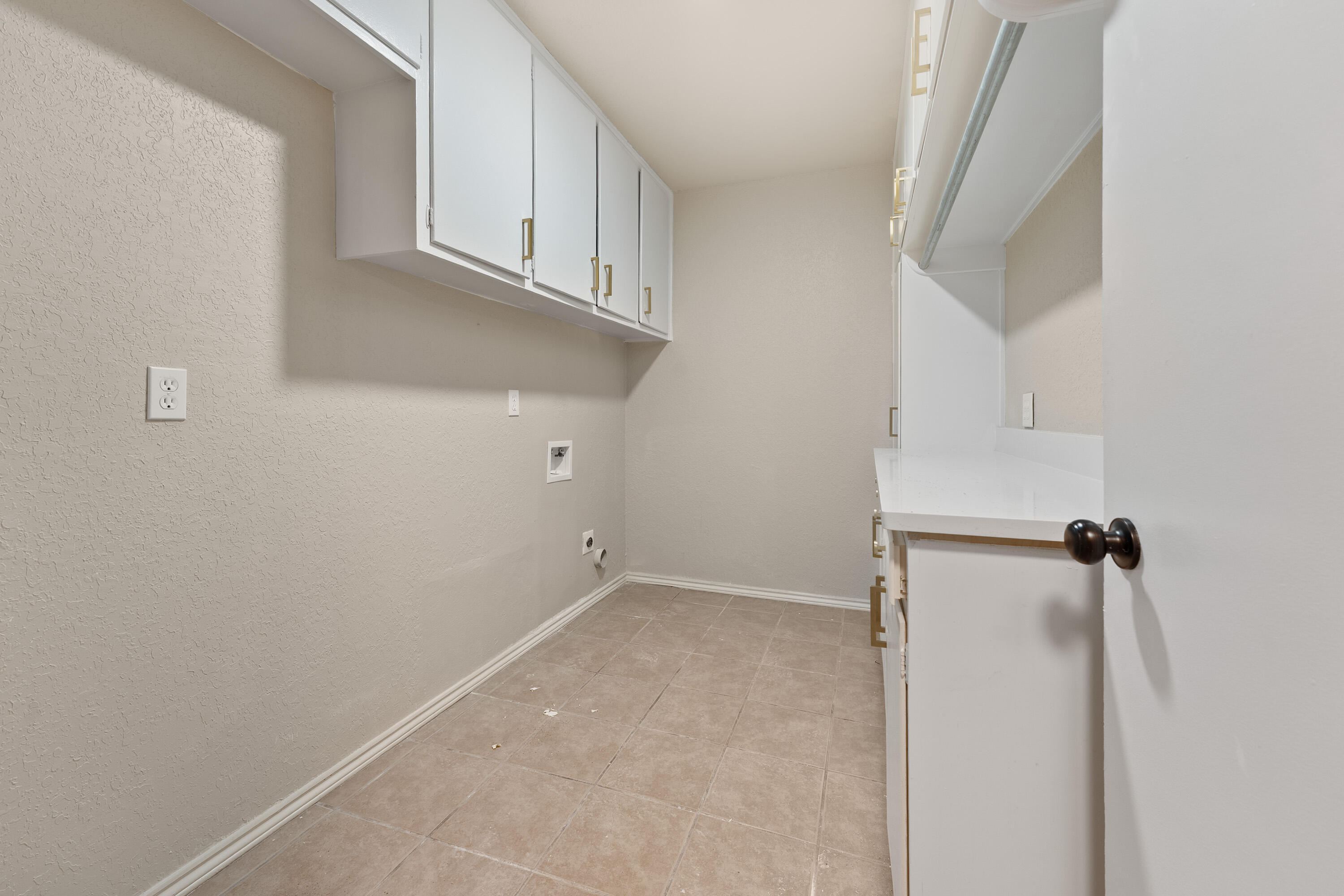 7902 Lynnhaven Avenue Lubbock, TX 79423 - Photo 31 of 35 a view of a kitchen with white cabinets