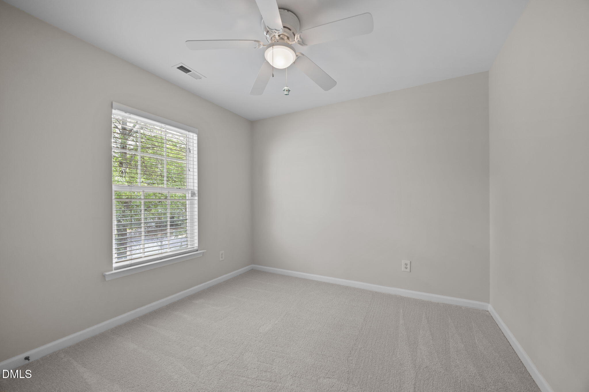 1003 Red Hat Lane Durham, NC 27713 - Photo 34 of 60 an empty room with a window and a fan
