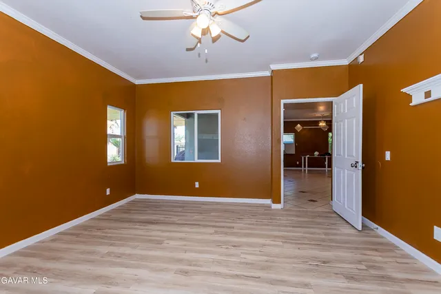 a white toilet sitting next to a bath tub and a shower