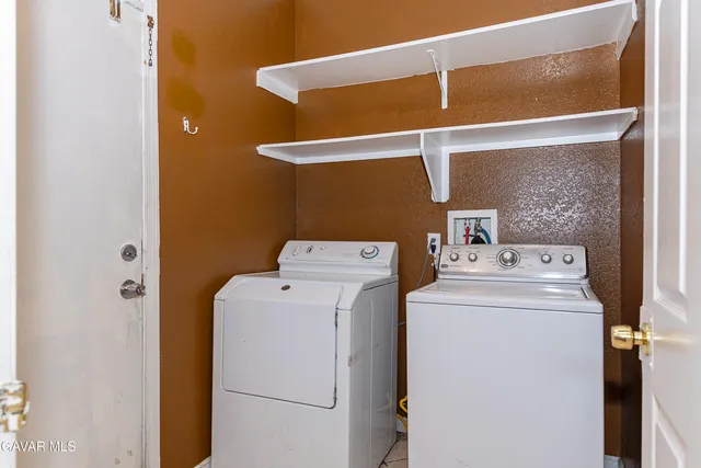 a view of a house with backyard and porch