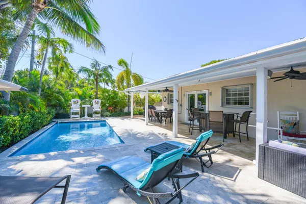 a view of a house with backyard porch and patio