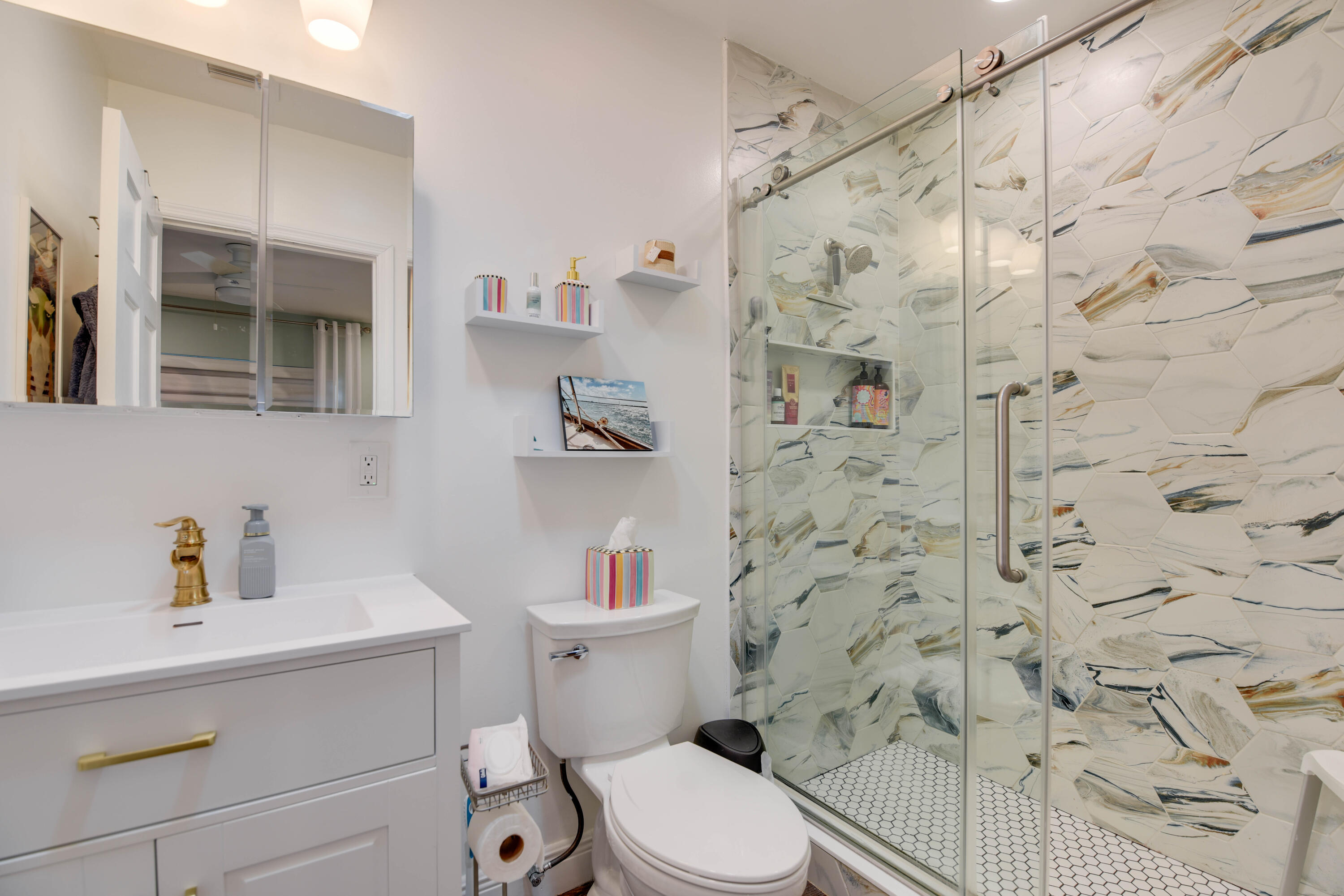 1720 Patricia Street Key West, FL 33040 - Photo 33 of 46 a white toilet sitting next to a bathroom sink