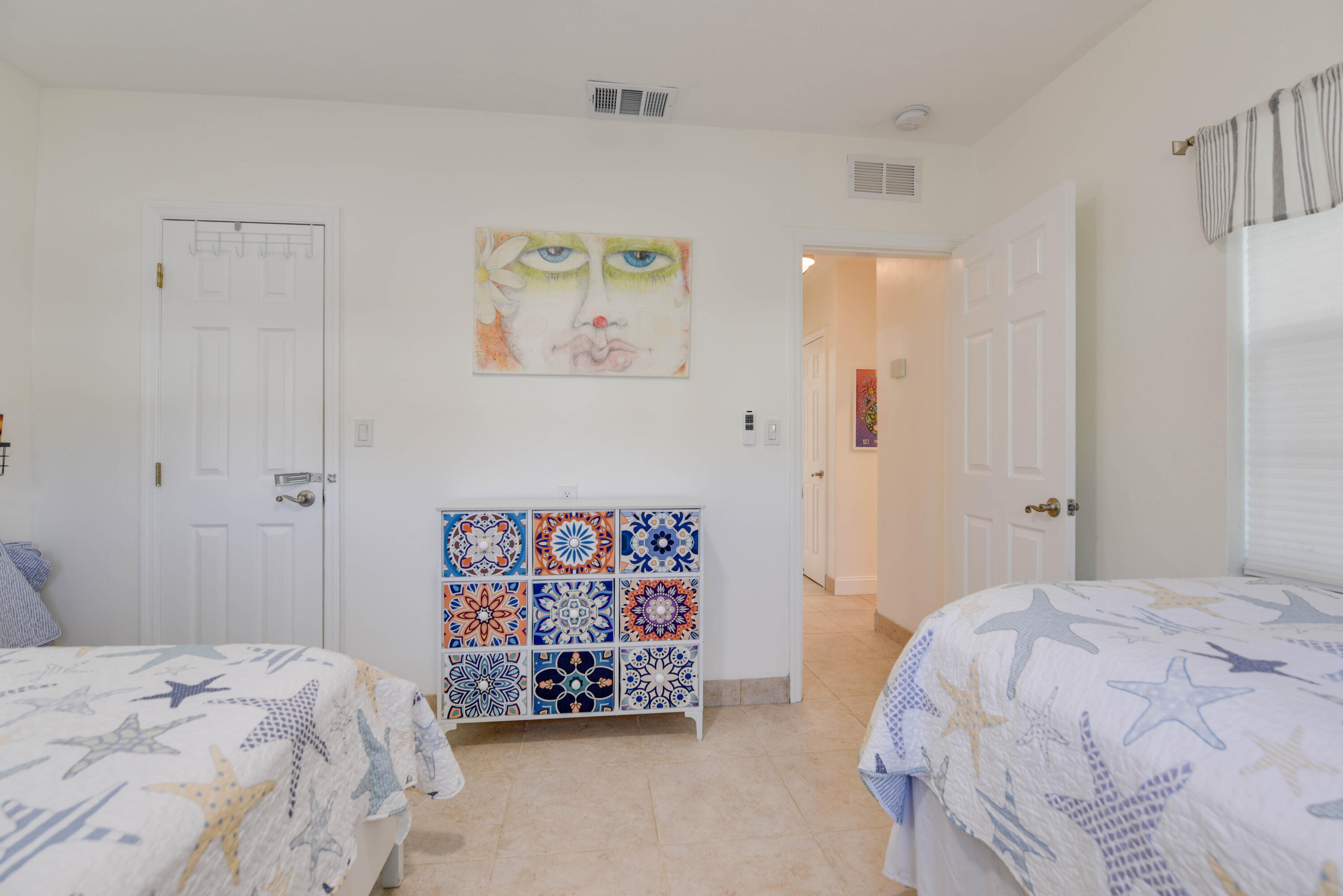 1720 Patricia Street Key West, FL 33040 - Photo 4 of 46 a bedroom with a bed and a wall painting