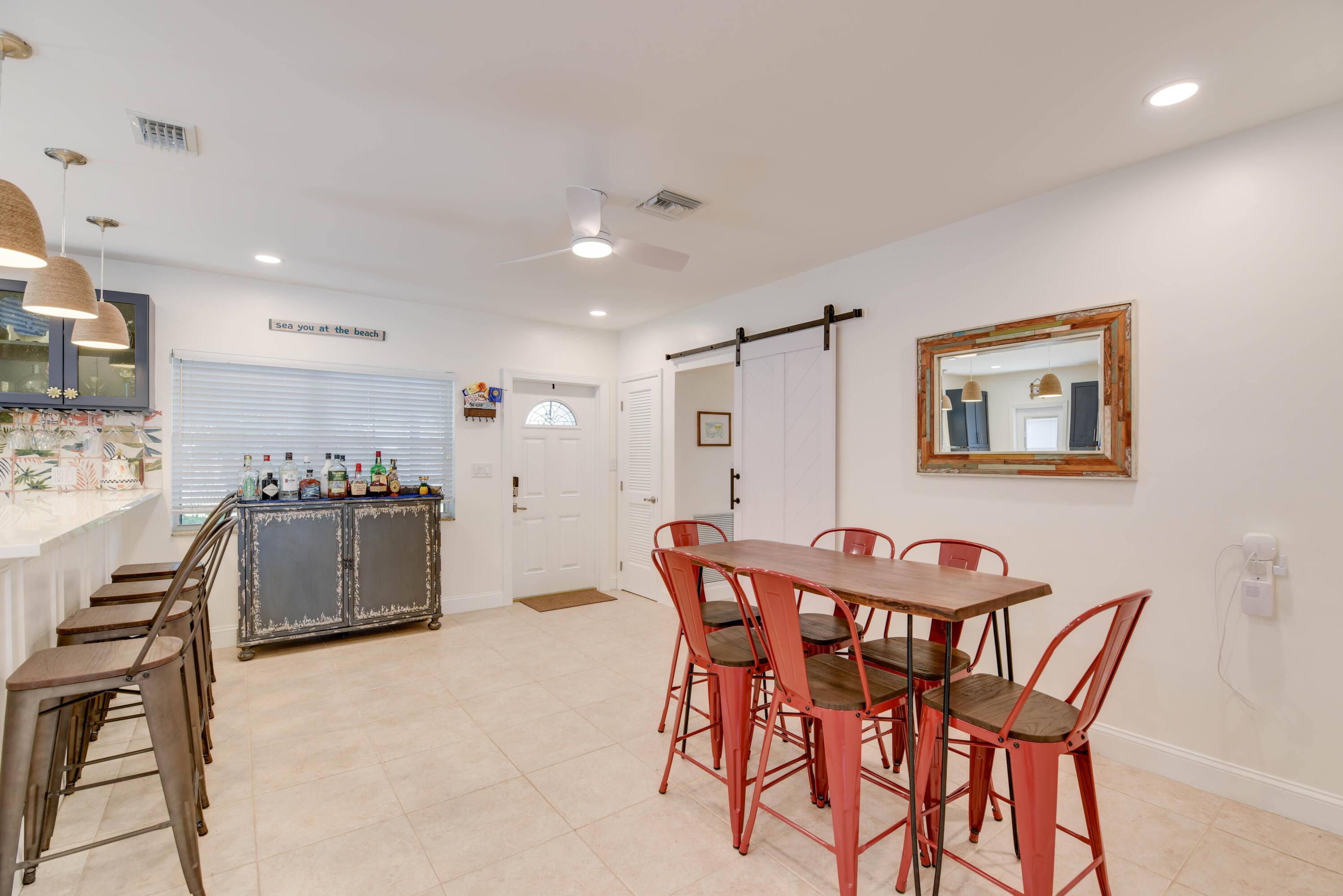 1720 Patricia Street Key West, FL 33040 - Photo 41 of 46 a dining room with a kitchen island a table and chairs