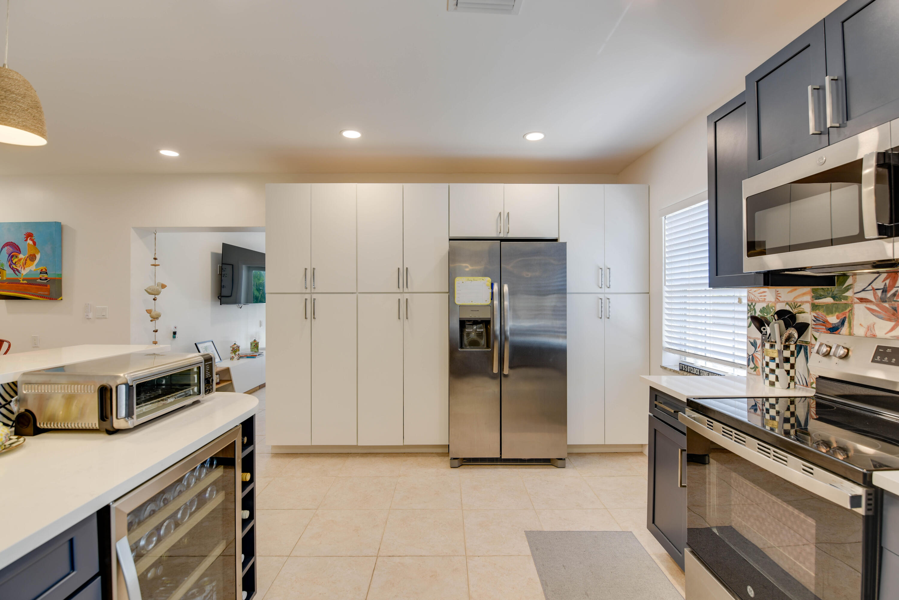 1720 Patricia Street Key West, FL 33040 - Photo 44 of 46 a kitchen with stainless steel appliances granite countertop a stove a sink and a refrigerator