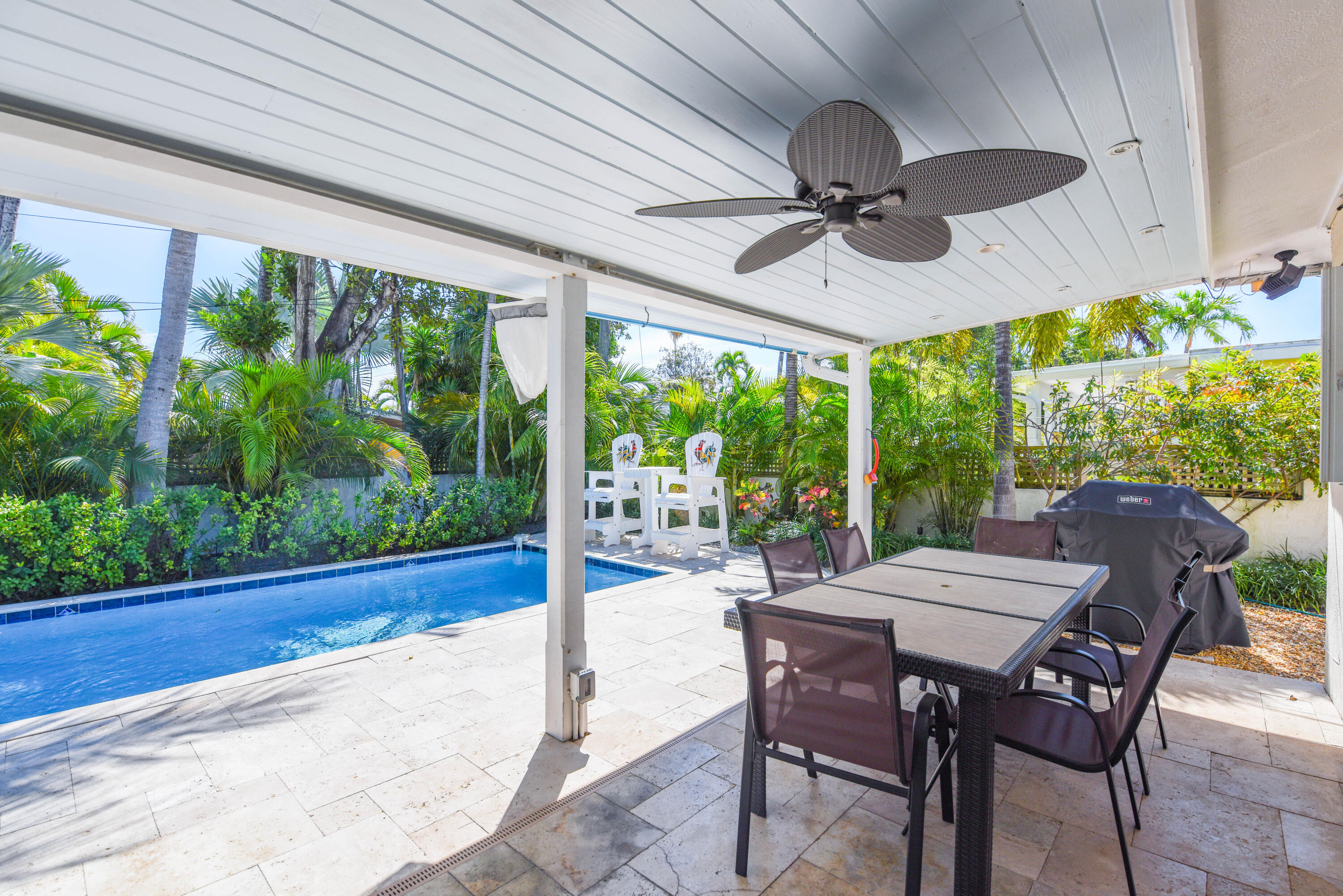 1720 Patricia Street Key West, FL 33040 - Photo 7 of 46 a view of a patio with a table chairs and a backyard