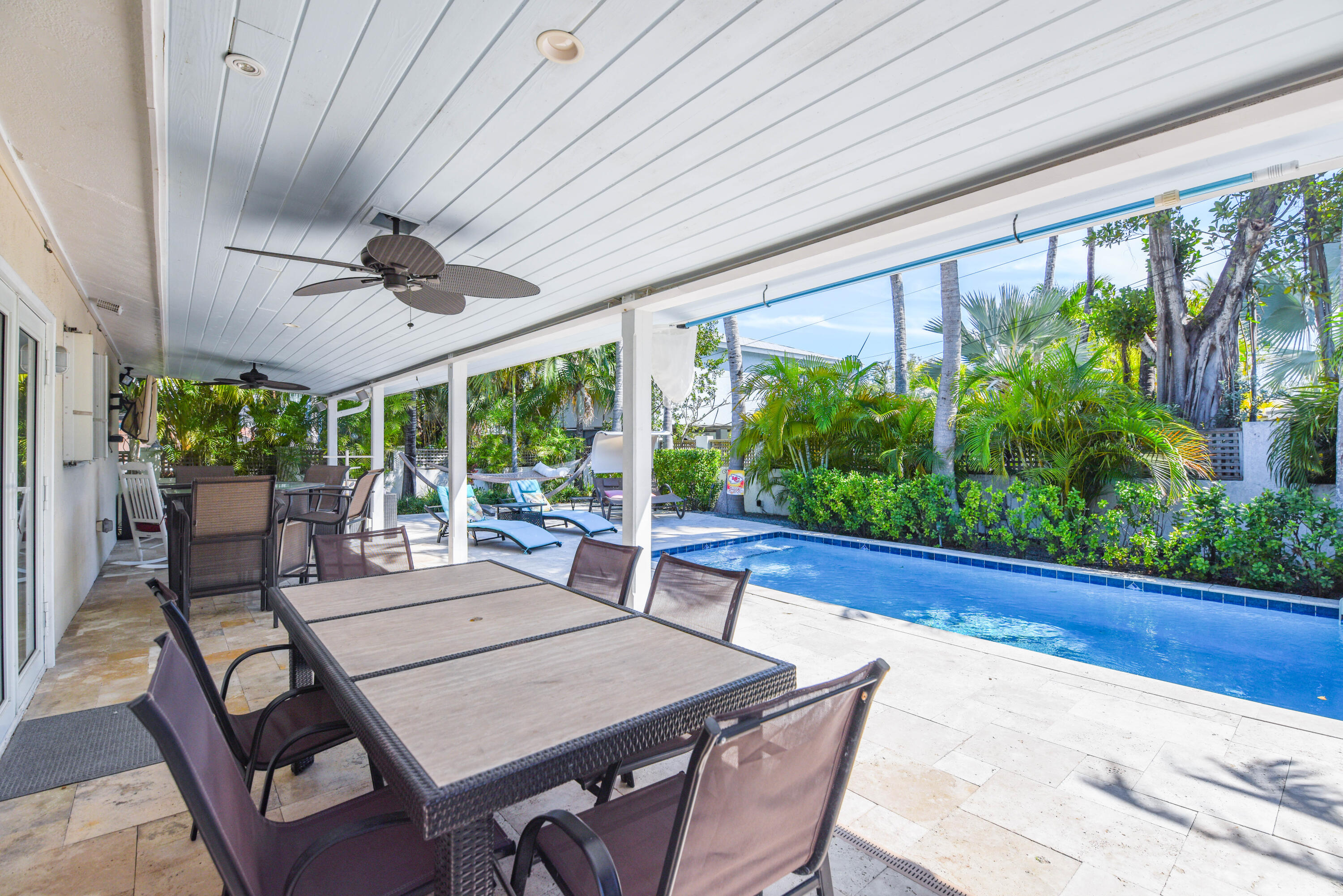 1720 Patricia Street Key West, FL 33040 - Photo 8 of 46 a view of a patio with a table chairs potted plants and a table