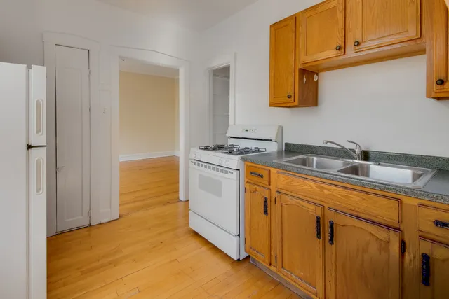 a utility room with cabinets washer and dryer