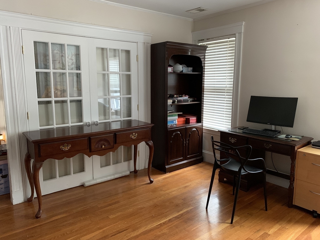 23 Lafayette Street, Unit 23 Arlington, MA 02474 - Photo 13 of 18 a view of a workspace with furniture and wooden floor