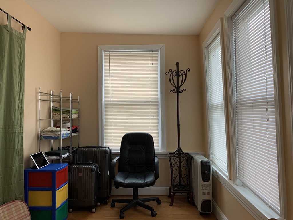 23 Lafayette Street, Unit 23 Arlington, MA 02474 - Photo 15 of 18 a view of a workspace with furniture and a window