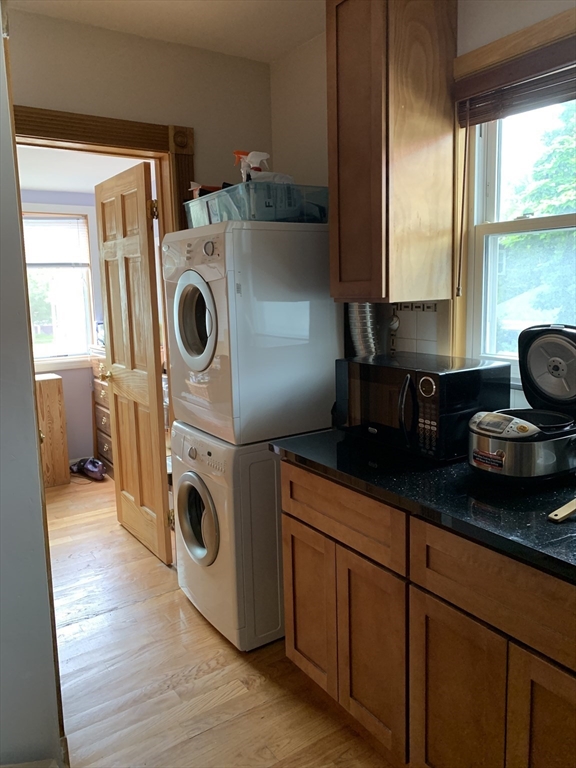 23 Lafayette Street, Unit 23 Arlington, MA 02474 - Photo 3 of 18 a utility room with sink dryer and washer
