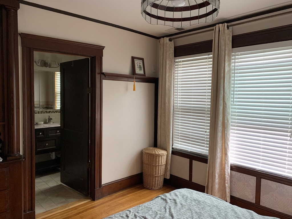 23 Lafayette Street, Unit 23 Arlington, MA 02474 - Photo 6 of 18 a room with furniture and a window