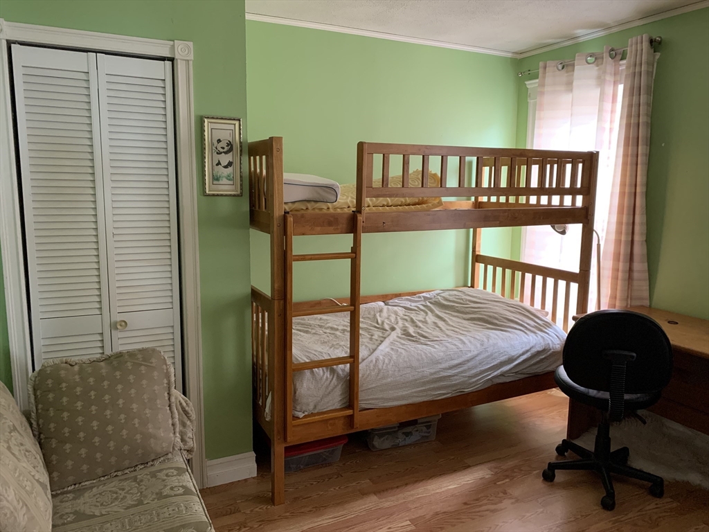 23 Lafayette Street, Unit 23 Arlington, MA 02474 - Photo 7 of 18 a bedroom with furniture and a window