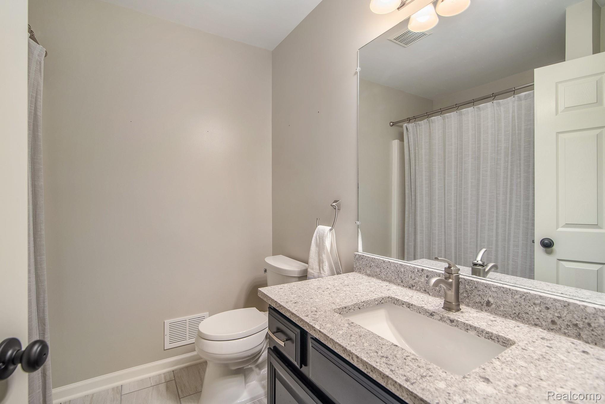 3658 Stratton Lane Howell, MI 48843 - Photo 13 of 23 full bath with updated vanity, sink, and flooring