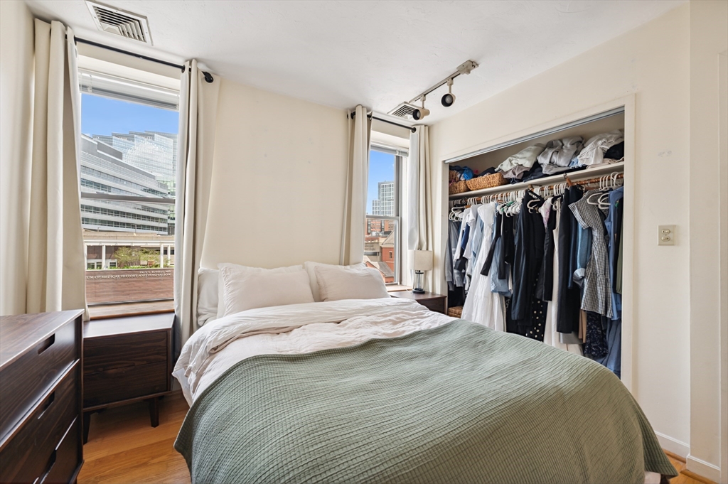 5 Grove Street, Unit 9 Boston, MA 02114 - Photo 11 of 24 a bedroom with a bed and a window