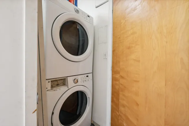 a view of a hallway with washer and dryer