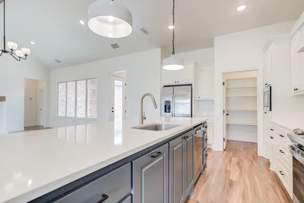 a kitchen with counter top space and sink
