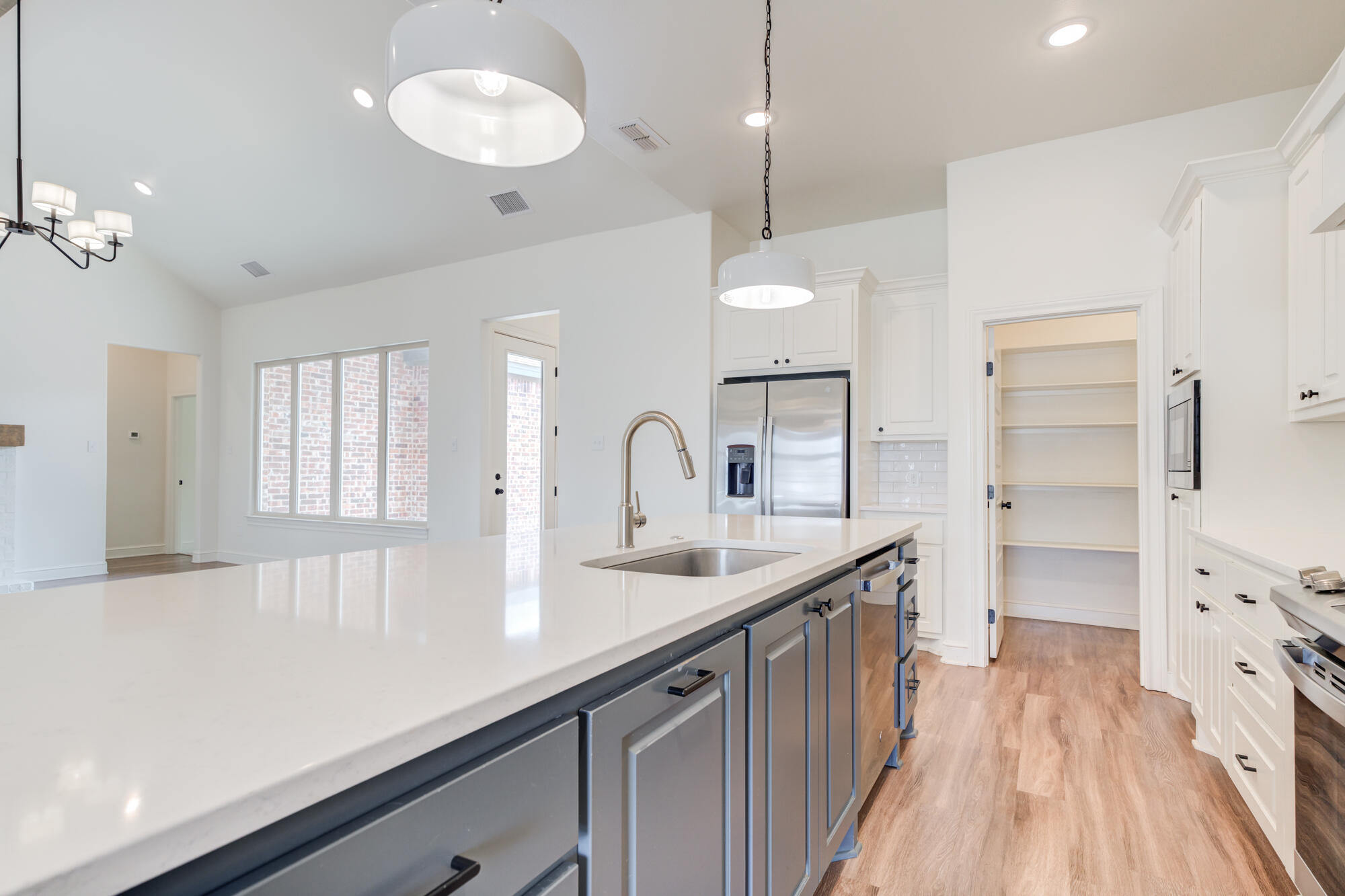 7603 52nd Street Lubbock, TX 79407 - Photo 14 of 46 a kitchen with counter top space and sink