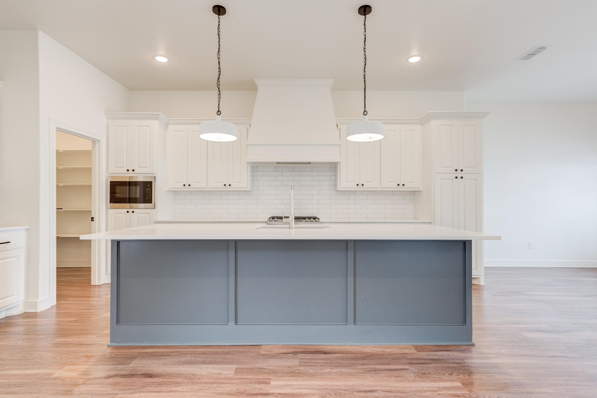 7603 52nd Street Lubbock, TX 79407 - Photo 15 of 46 a kitchen with stainless steel appliances granite countertop a sink a refrigerator and a stove