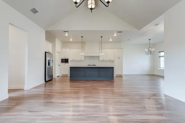 a view of kitchen with wooden floor