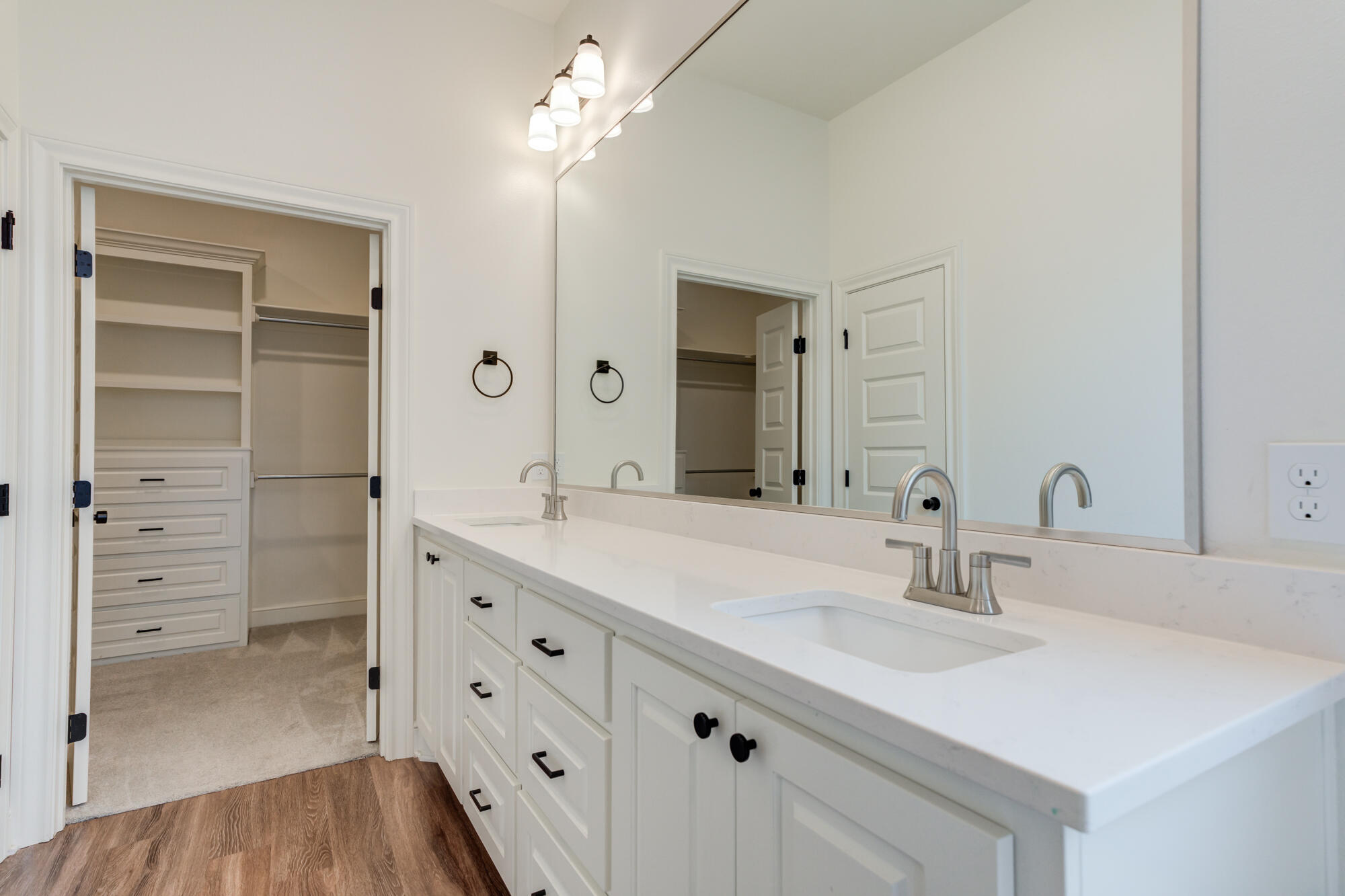 7603 52nd Street Lubbock, TX 79407 - Photo 30 of 46 a bathroom with a sink double vanity and a mirror
