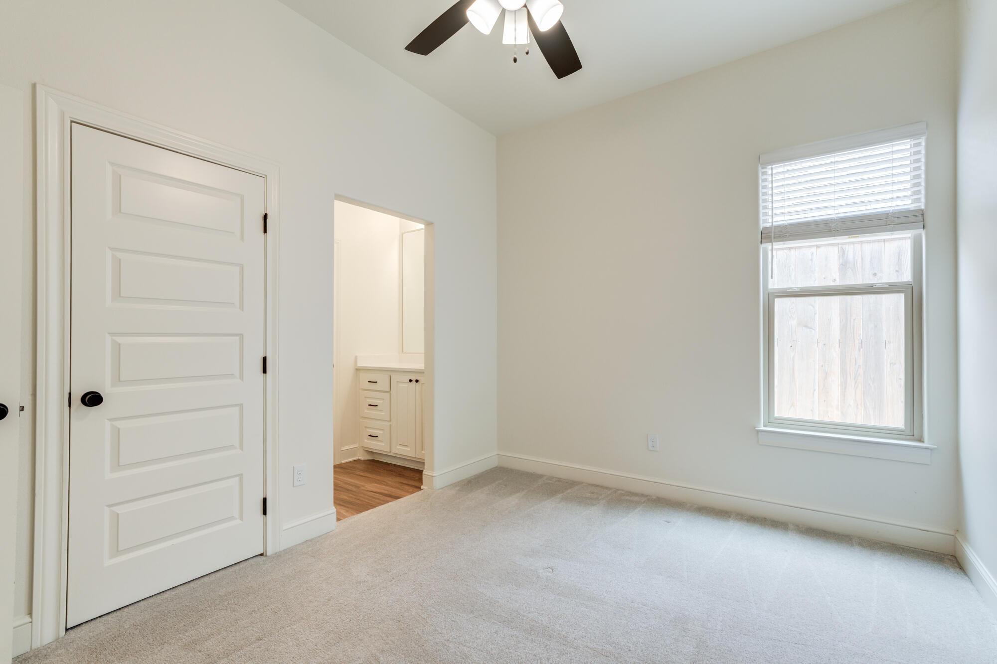 7603 52nd Street Lubbock, TX 79407 - Photo 34 of 46 an empty room with chandelier fan and windows