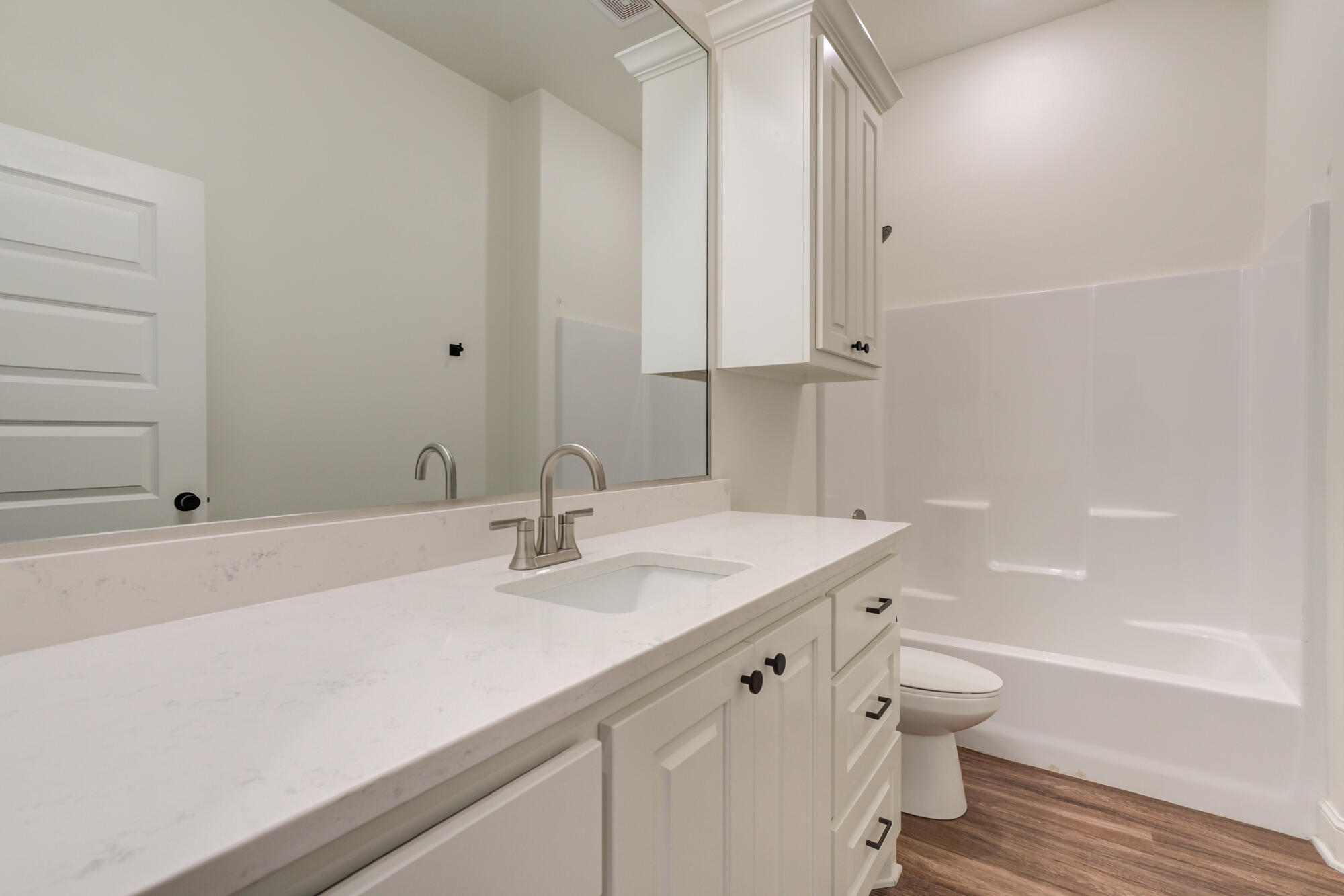 7603 52nd Street Lubbock, TX 79407 - Photo 43 of 46 a bathroom with a sink a toilet and shower