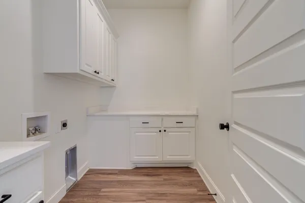 a view of storage and utility room in white wall
