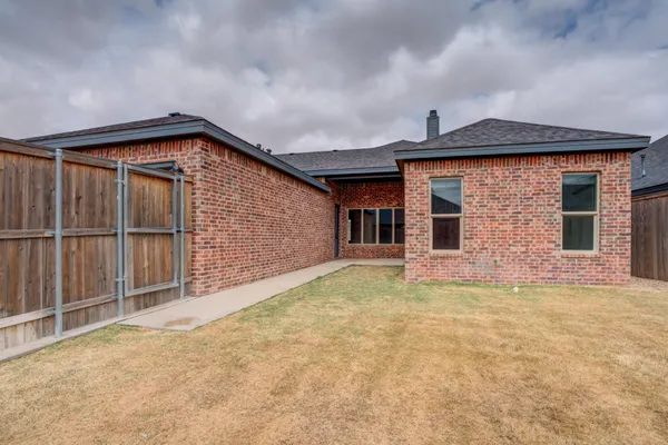 a front view of a house with plants