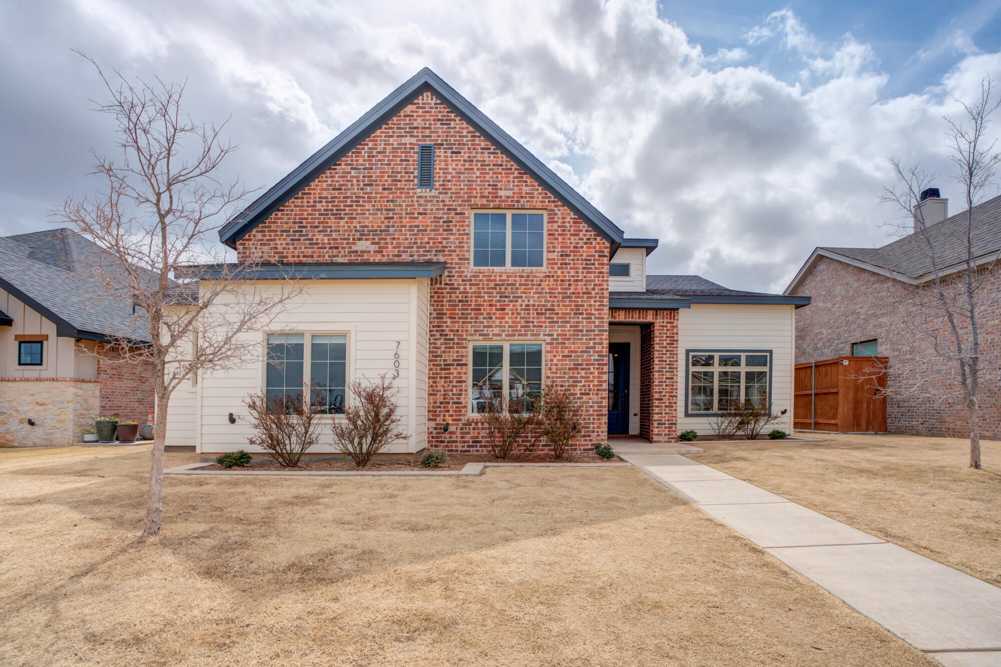 7603 52nd Street Lubbock, TX 79407 - Photo 6 of 46 a front view of a house with a yard