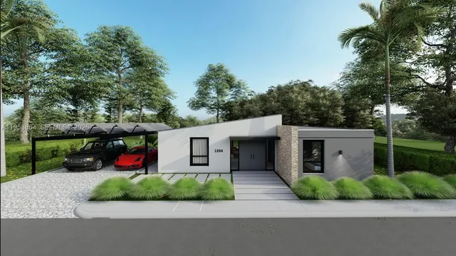 a front view of a house with garden and plants