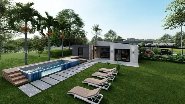 a view of a patio with couches chairs and a big yard