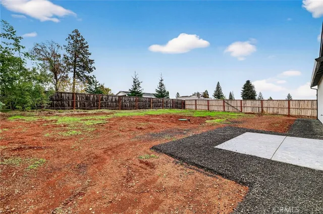 a view of a swimming pool with a yard