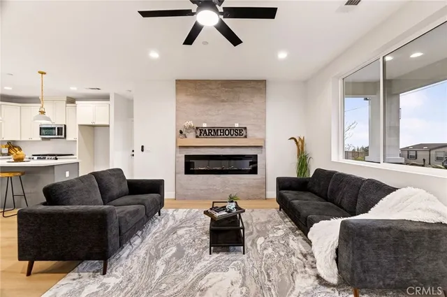 a living room with furniture and a large window