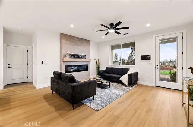 a living room with furniture and a fireplace