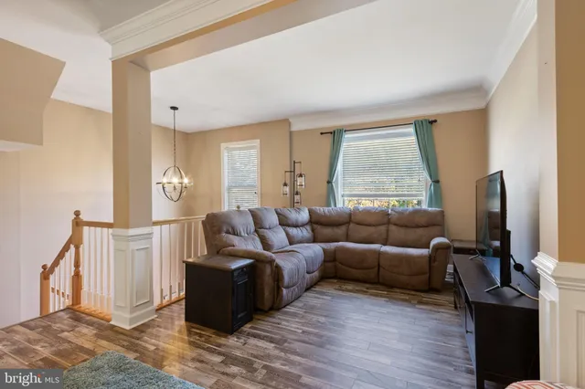 a living room with furniture and a rug