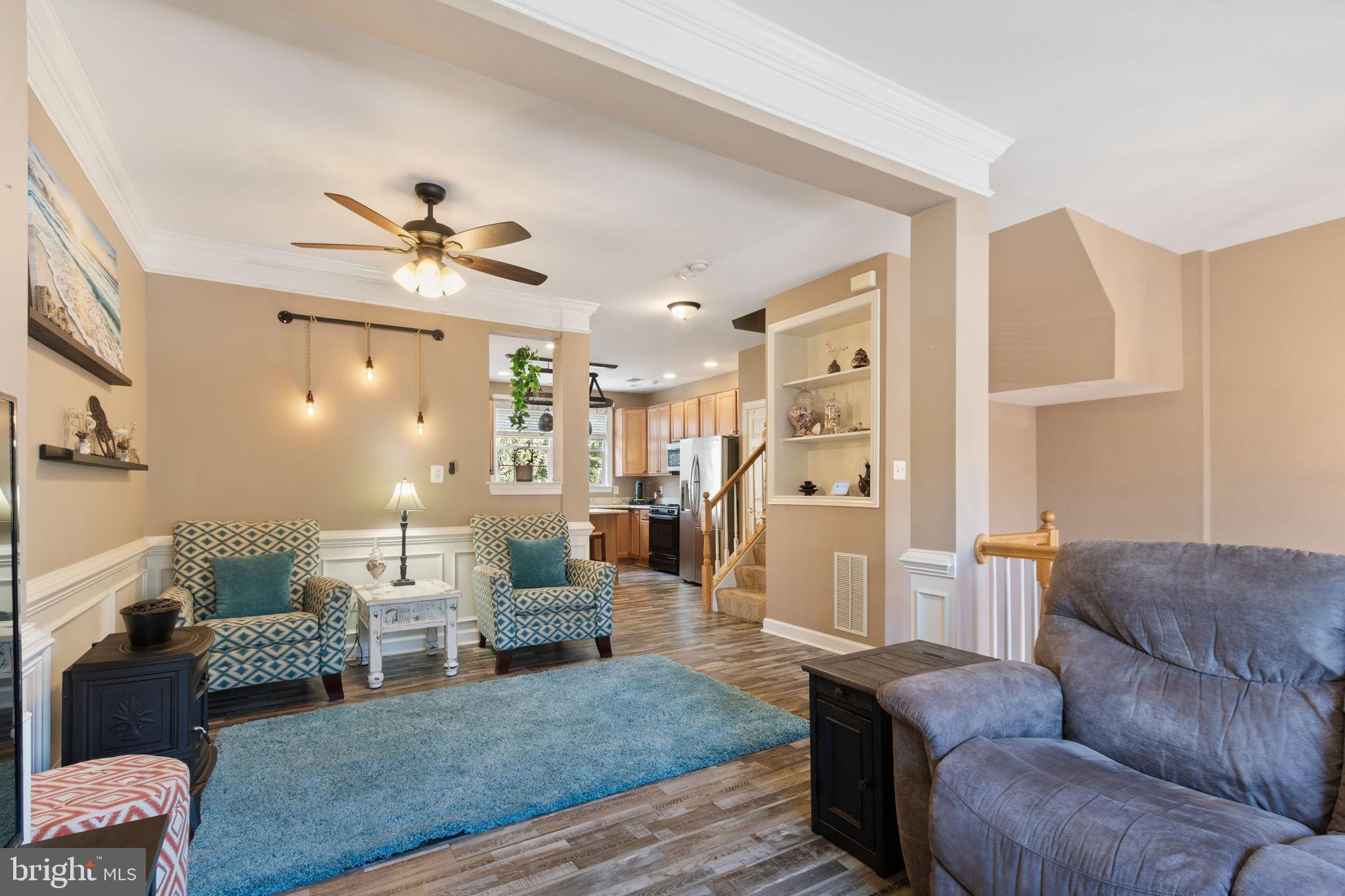 15636 Avocet Loop Woodbridge, VA 22191 - Photo 14 of 60 a living room with furniture and a chandelier