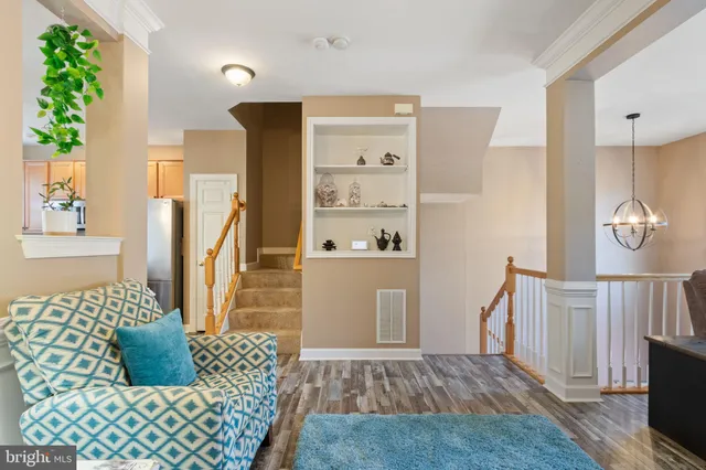 a kitchen with a table chairs sink microwave and stove