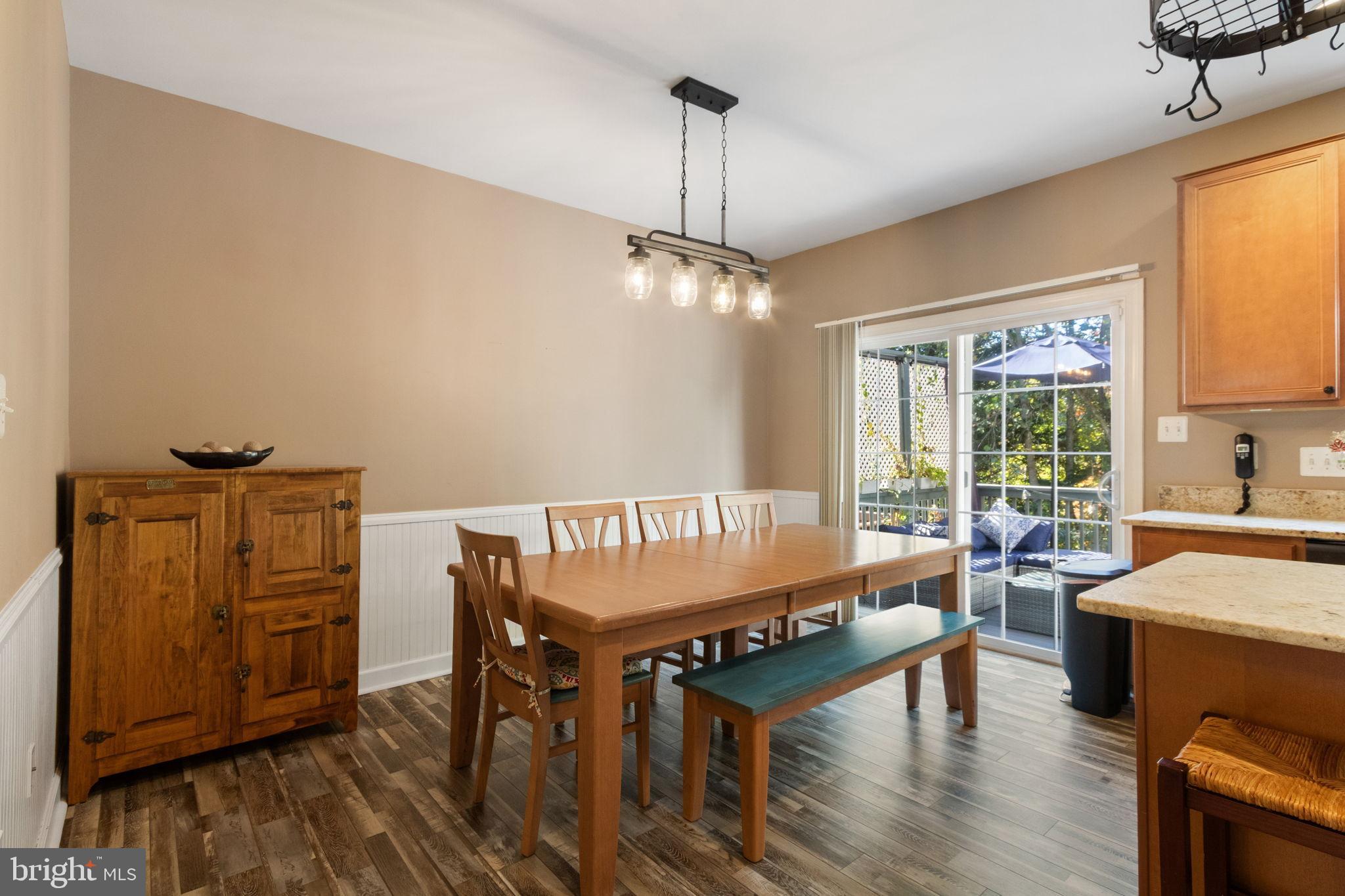 15636 Avocet Loop Woodbridge, VA 22191 - Photo 22 of 60 a dining room with furniture window wooden floor
