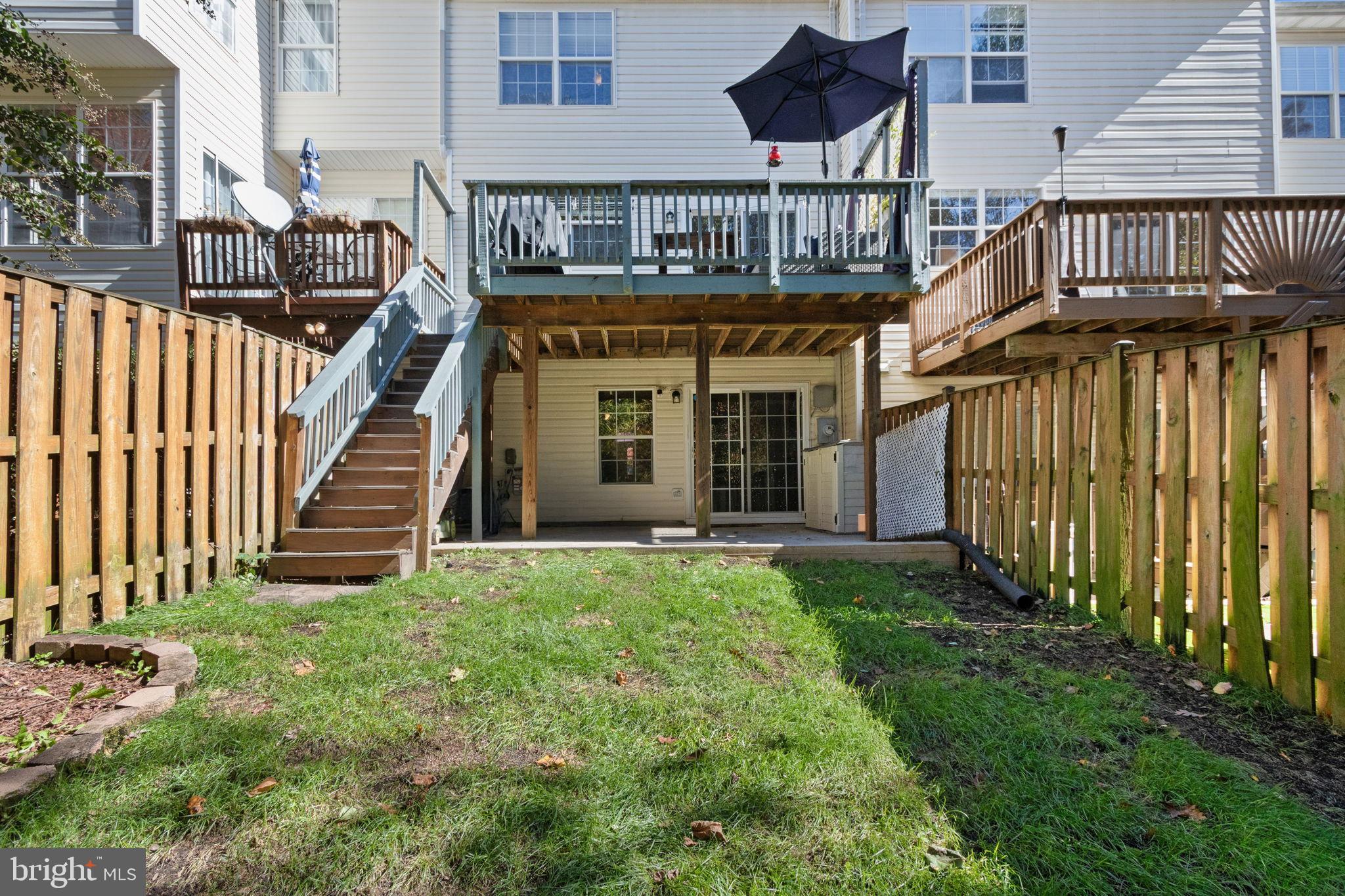 15636 Avocet Loop Woodbridge, VA 22191 - Photo 27 of 60 a view of a house with backyard and porch