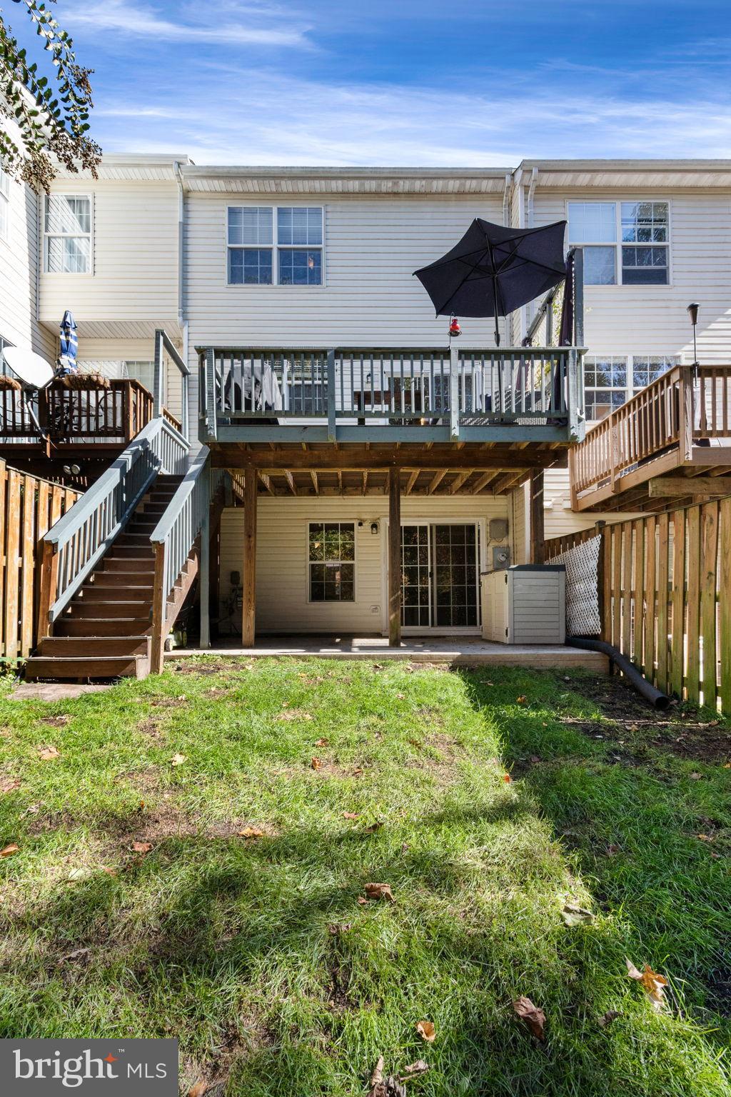 15636 Avocet Loop Woodbridge, VA 22191 - Photo 28 of 60 a view of a house with backyard and porch