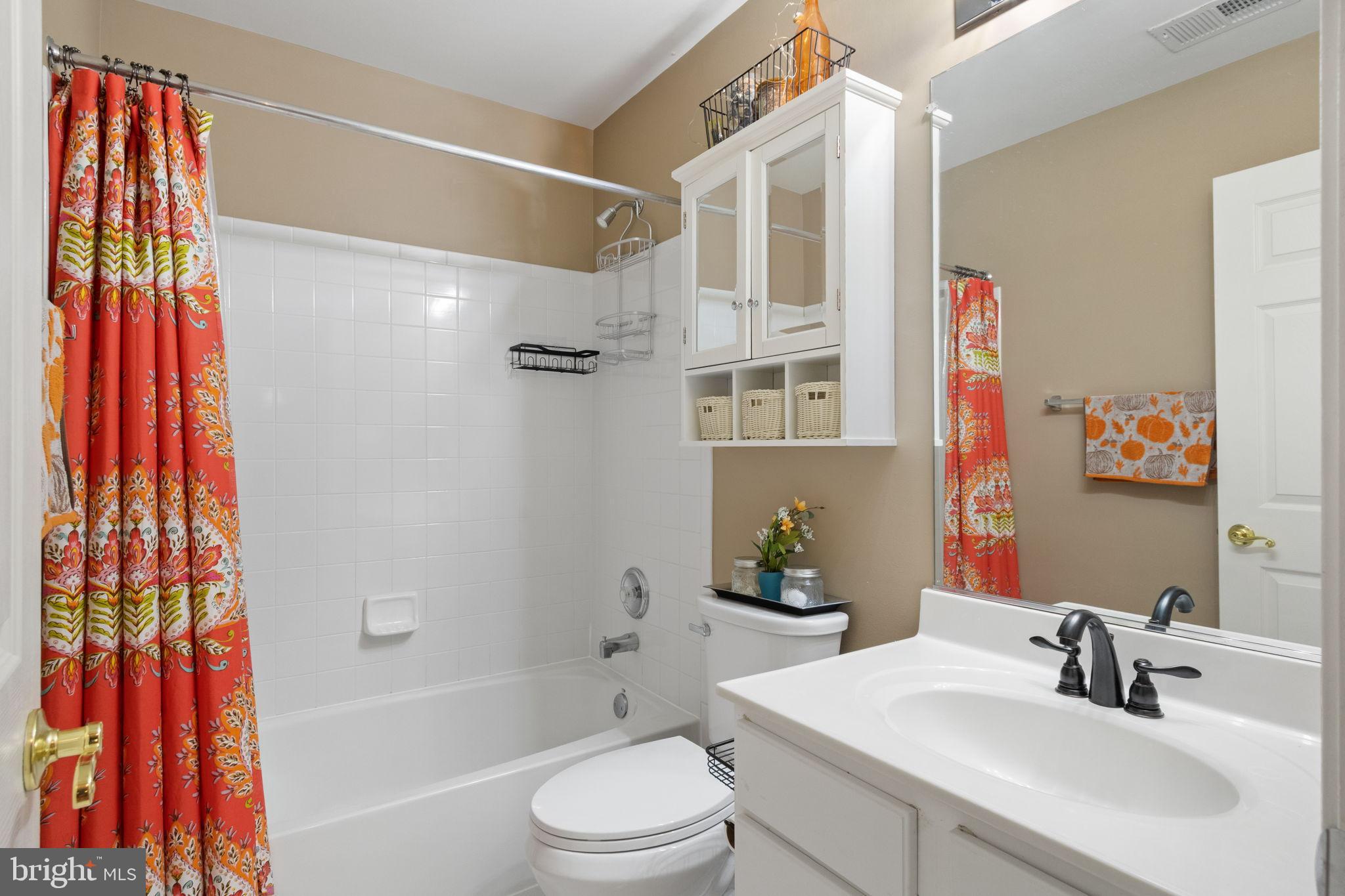 15636 Avocet Loop Woodbridge, VA 22191 - Photo 33 of 60 a bathroom with a sink toilet and shower